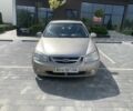 Бежевый Киа Черато, объемом двигателя 2 л и пробегом 216 тыс. км за 3400 $, фото 5 на Automoto.ua