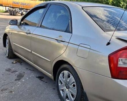 Бежевый Киа Черато, объемом двигателя 2 л и пробегом 200 тыс. км за 3750 $, фото 4 на Automoto.ua