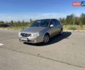 Бежевый Киа Черато, объемом двигателя 2 л и пробегом 160 тыс. км за 4400 $, фото 1 на Automoto.ua