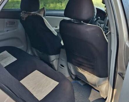 Бежевый Киа Черато, объемом двигателя 2 л и пробегом 200 тыс. км за 3750 $, фото 2 на Automoto.ua