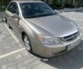 Бежевый Киа Черато, объемом двигателя 2 л и пробегом 216 тыс. км за 3400 $, фото 4 на Automoto.ua