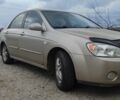 Бежевый Киа Черато, объемом двигателя 2 л и пробегом 270 тыс. км за 3700 $, фото 1 на Automoto.ua