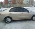 Бежевий Кіа Черато, об'ємом двигуна 2 л та пробігом 222 тис. км за 4900 $, фото 3 на Automoto.ua