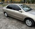 Бежевий Кіа Черато, об'ємом двигуна 1.6 л та пробігом 185 тис. км за 5000 $, фото 1 на Automoto.ua