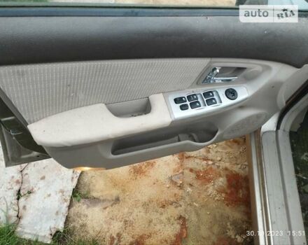 Бежевый Киа Черато, объемом двигателя 1.59 л и пробегом 208 тыс. км за 1900 $, фото 16 на Automoto.ua