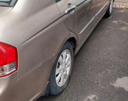 Бежевий Кіа Черато, об'ємом двигуна 2 л та пробігом 222 тис. км за 4900 $, фото 6 на Automoto.ua