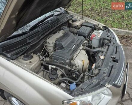 Бежевый Киа Черато, объемом двигателя 2 л и пробегом 210 тыс. км за 5300 $, фото 16 на Automoto.ua