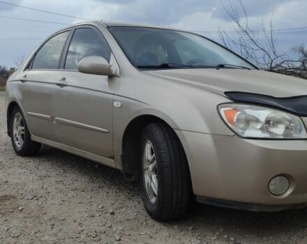 Бежевый Киа Черато, объемом двигателя 2 л и пробегом 270 тыс. км за 3700 $, фото 1 на Automoto.ua