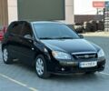 Черный Киа Черато, объемом двигателя 1.6 л и пробегом 157 тыс. км за 4400 $, фото 1 на Automoto.ua
