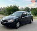 Черный Киа Черато, объемом двигателя 2 л и пробегом 197 тыс. км за 3900 $, фото 1 на Automoto.ua