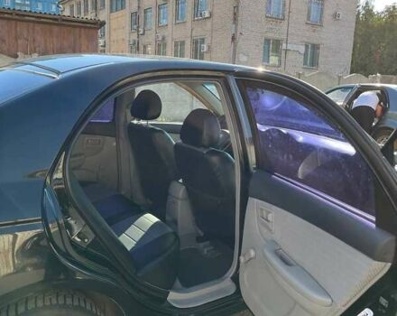Черный Киа Черато, объемом двигателя 1.58 л и пробегом 190 тыс. км за 4300 $, фото 2 на Automoto.ua