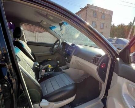 Черный Киа Черато, объемом двигателя 1.58 л и пробегом 190 тыс. км за 4300 $, фото 3 на Automoto.ua