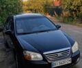 Черный Киа Черато, объемом двигателя 1.6 л и пробегом 280 тыс. км за 3517 $, фото 1 на Automoto.ua