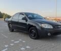 Чорний Кіа Черато, об'ємом двигуна 1.6 л та пробігом 220 тис. км за 3500 $, фото 1 на Automoto.ua