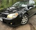 Чорний Кіа Черато, об'ємом двигуна 2 л та пробігом 207 тис. км за 4999 $, фото 1 на Automoto.ua