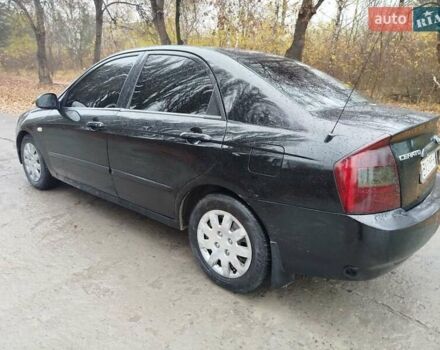Черный Киа Черато, объемом двигателя 1.6 л и пробегом 280 тыс. км за 2999 $, фото 6 на Automoto.ua