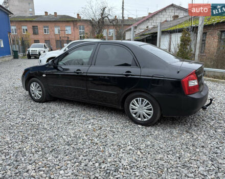 Черный Киа Черато, объемом двигателя 1.6 л и пробегом 220 тыс. км за 3300 $, фото 10 на Automoto.ua