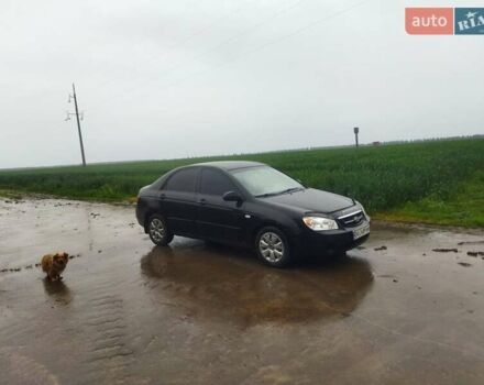 Черный Киа Черато, объемом двигателя 1.6 л и пробегом 300 тыс. км за 3900 $, фото 2 на Automoto.ua