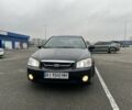 Черный Киа Черато, объемом двигателя 1.6 л и пробегом 230 тыс. км за 3200 $, фото 1 на Automoto.ua