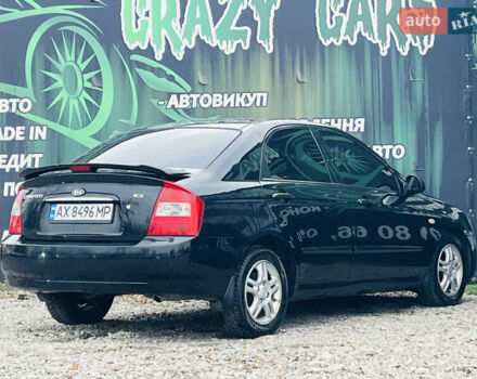 Чорний Кіа Черато, об'ємом двигуна 2 л та пробігом 319 тис. км за 4300 $, фото 5 на Automoto.ua