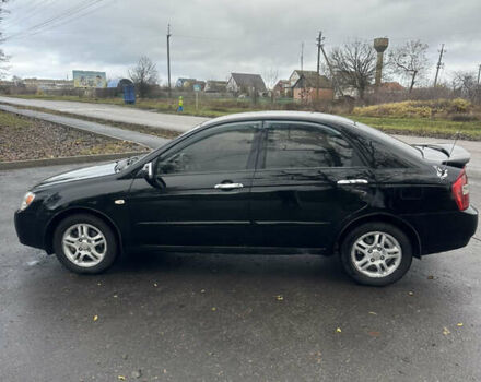 Черный Киа Черато, объемом двигателя 1.98 л и пробегом 236 тыс. км за 4100 $, фото 7 на Automoto.ua