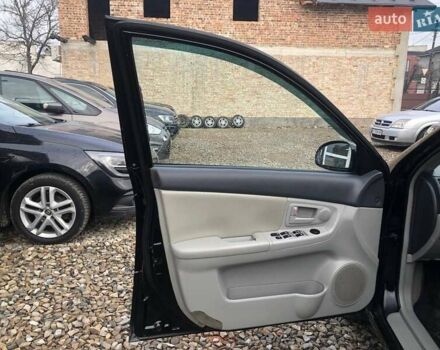 Чорний Кіа Черато, об'ємом двигуна 2 л та пробігом 177 тис. км за 4399 $, фото 11 на Automoto.ua