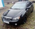 Черный Киа Черато, объемом двигателя 2 л и пробегом 240 тыс. км за 4200 $, фото 1 на Automoto.ua
