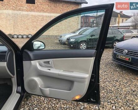 Чорний Кіа Черато, об'ємом двигуна 2 л та пробігом 177 тис. км за 4399 $, фото 23 на Automoto.ua