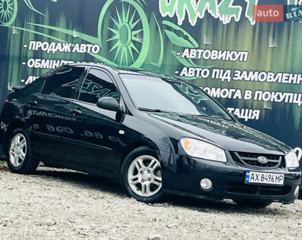 Чорний Кіа Черато, об'ємом двигуна 2 л та пробігом 319 тис. км за 4300 $, фото 1 на Automoto.ua