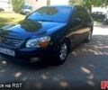 Чорний Кіа Черато, об'ємом двигуна 2 л та пробігом 203 тис. км за 4500 $, фото 1 на Automoto.ua