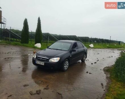 Черный Киа Черато, объемом двигателя 1.6 л и пробегом 300 тыс. км за 3900 $, фото 1 на Automoto.ua