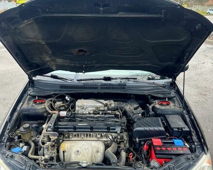 Черный Киа Черато, объемом двигателя 2 л и пробегом 232 тыс. км за 4100 $, фото 12 на Automoto.ua