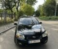Черный Киа Черато, объемом двигателя 1.6 л и пробегом 181 тыс. км за 3900 $, фото 1 на Automoto.ua