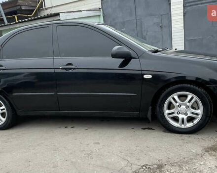 Черный Киа Черато, объемом двигателя 2 л и пробегом 318 тыс. км за 3900 $, фото 2 на Automoto.ua