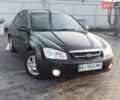Черный Киа Черато, объемом двигателя 1.6 л и пробегом 230 тыс. км за 4250 $, фото 1 на Automoto.ua