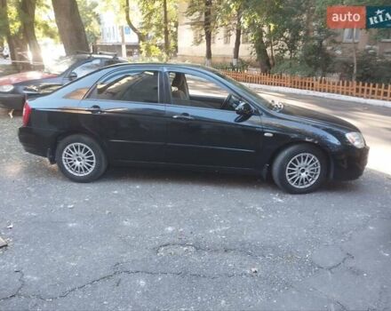 Черный Киа Черато, объемом двигателя 2 л и пробегом 220 тыс. км за 4900 $, фото 2 на Automoto.ua