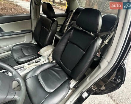 Чорний Кіа Черато, об'ємом двигуна 1.98 л та пробігом 240 тис. км за 5100 $, фото 7 на Automoto.ua