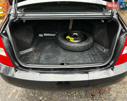 Чорний Кіа Черато, об'ємом двигуна 1.98 л та пробігом 240 тис. км за 5100 $, фото 15 на Automoto.ua