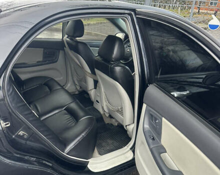 Черный Киа Черато, объемом двигателя 1.98 л и пробегом 236 тыс. км за 4100 $, фото 13 на Automoto.ua