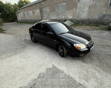 Черный Киа Черато, объемом двигателя 1.6 л и пробегом 286 тыс. км за 3500 $, фото 5 на Automoto.ua