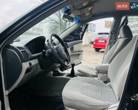 Чорний Кіа Черато, об'ємом двигуна 2 л та пробігом 319 тис. км за 4300 $, фото 8 на Automoto.ua