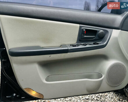 Чорний Кіа Черато, об'ємом двигуна 2 л та пробігом 319 тис. км за 4300 $, фото 10 на Automoto.ua