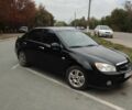 Чорний Кіа Черато, об'ємом двигуна 1.6 л та пробігом 290 тис. км за 4497 $, фото 1 на Automoto.ua