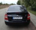 Черный Киа Черато, объемом двигателя 1.6 л и пробегом 290 тыс. км за 5000 $, фото 1 на Automoto.ua