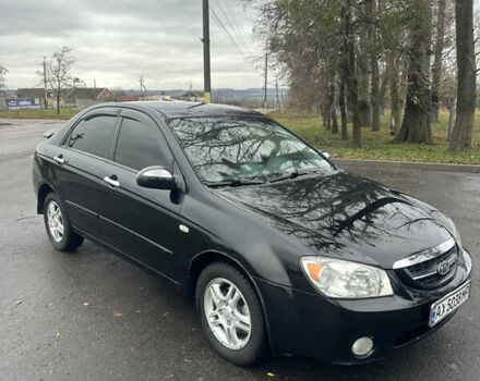 Черный Киа Черато, объемом двигателя 1.98 л и пробегом 236 тыс. км за 4100 $, фото 2 на Automoto.ua