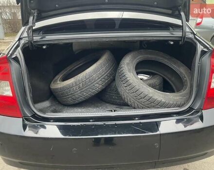 Черный Киа Черато, объемом двигателя 2 л и пробегом 318 тыс. км за 3900 $, фото 7 на Automoto.ua