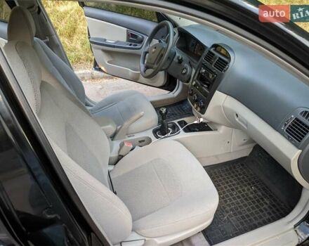 Чорний Кіа Черато, об'ємом двигуна 1.5 л та пробігом 221 тис. км за 4200 $, фото 14 на Automoto.ua