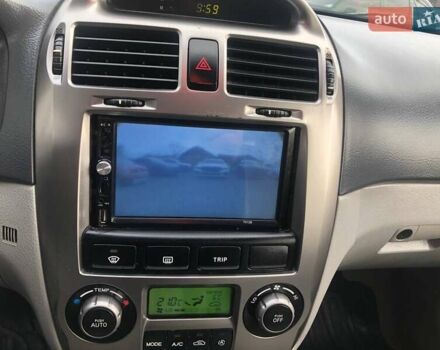 Чорний Кіа Черато, об'ємом двигуна 2 л та пробігом 177 тис. км за 4399 $, фото 29 на Automoto.ua