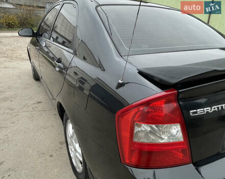 Черный Киа Черато, объемом двигателя 2 л и пробегом 318 тыс. км за 3900 $, фото 4 на Automoto.ua