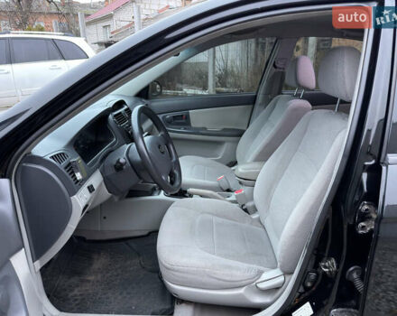 Черный Киа Черато, объемом двигателя 1.6 л и пробегом 220 тыс. км за 3300 $, фото 13 на Automoto.ua